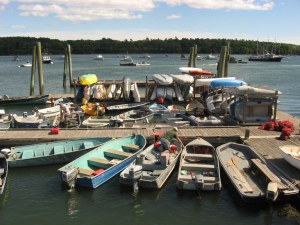 Pastel-colored boats docked at the Freeport Town Wharf