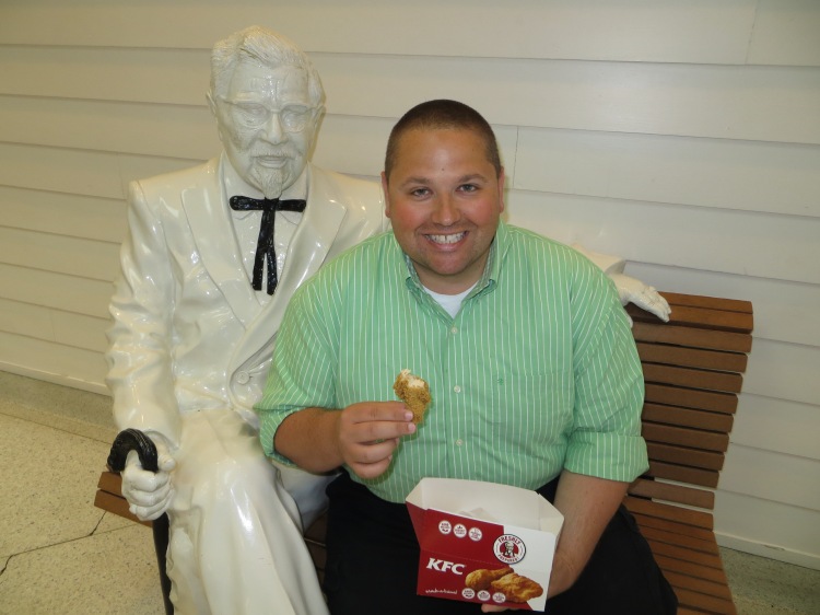 Johnny having a bite of chicken with Colonel Sanders